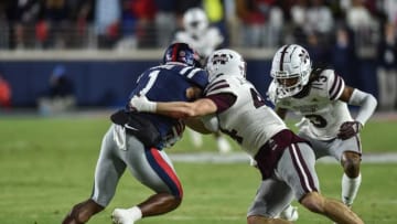 Mississippi State WR Caleb Ducking (4) tackles Ole Miss WR Jonathan Mango (1) in the 2022 Egg Bowl at Ole Miss' Vaught-Hemingway Stadium in Oxford, Miss., Thursday, November 24, 2022.Ejs 3589