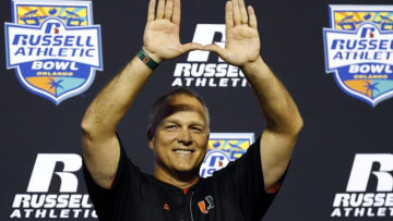 Dec 28, 2016; Orlando, FL, USA; Miami Hurricanes head coach Mark Richt (center) celebrates after a game against the Miami Hurricanes at Camping World Stadium. The Miami Hurricanes won 31-14. Mandatory Credit: Logan Bowles-USA TODAY Sports