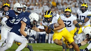 STATE COLLEGE, PA - OCTOBER 21: Ty Isaac #32 of the Michigan Wolverines rushes for a 6 yard touchdown in the first half against Troy Apke #28 of the Penn State Nittany Lions on October 21, 2017 at Beaver Stadium in State College, Pennsylvania. (Photo by Justin K. Aller/Getty Images)