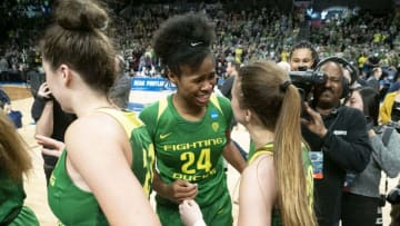 PORTLAND, OR - MARCH 31: Oregon Ducks forward Ruthy Hebard (24) reacts with Oregon Ducks guard Sabrina Ionescu (20) during the NCAA Division I Women's Championship Elite Eight round basketball game between the Oregon Ducks and Mississippi State Bulldogs on March 31, 2019 at Moda Center in Portland, Oregon. (Photo by Joseph Weiser/Icon Sportswire via Getty Images)