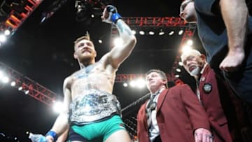 December 12, 2015; Las Vegas, NV, USA; Conor McGregor exits the octagon following his championship victory against Jose Aldo during UFC 194 at MGM Grand Garden Arena. Mandatory Credit: Gary A. Vasquez-USA TODAY Sports