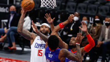 Clippers center DeMarcus Cousins (15) shoots on Detroit Pistons forward Saddiq Bey (41) and guard Josh Jackson (20). Credit: Rick Osentoski-USA TODAY Sports