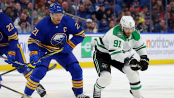 Mar 9, 2023; Buffalo, New York, USA; Buffalo Sabres right wing Kyle Okposo (21) and Dallas Stars center Tyler Seguin (91) go after a loose puck during the first period at KeyBank Center. Mandatory Credit: Timothy T. Ludwig-USA TODAY Sports