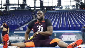 INDIANAPOLIS, IN - MARCH 01: Offensive lineman Greg Little of Ole Miss stretches prior to running the 40-yard dash during day two of the NFL Combine at Lucas Oil Stadium on March 1, 2019 in Indianapolis, Indiana. (Photo by Joe Robbins/Getty Images)