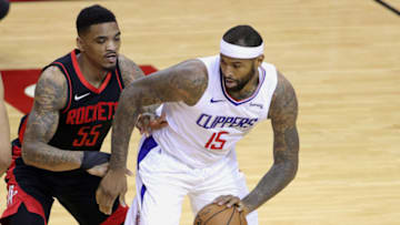 Apr 23, 2021; Houston, Texas, USA; DeMarcus Cousins #15 of the Los Angeles Clippers dribbles against DaQuan Jeffries #55 of the Houston Rockets during the first quarter at Toyota Center. Mandatory Credit: Carmen Mandato/POOL PHOTOS-USA TODAY Sports