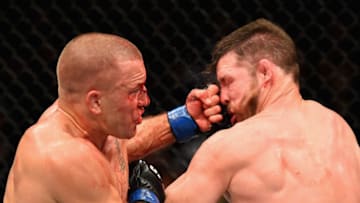 NEW YORK, NY - NOVEMBER 04: Georges St-Pierre of Canada lands a punch to take down Michael Bisping of England in their UFC middleweight championship bout during the UFC 217 event at Madison Square Garden on November 4, 2017 in New York City. (Photo by Josh Hedges/Zuffa LLC/Zuffa LLC via Getty Images)