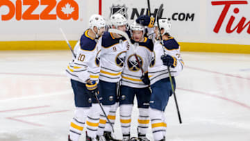 WINNIPEG, MB - NOVEMBER 16: Patrik Berglund #10, Jack Eichel #9, Jeff Skinner #53 and Sam Reinhart #23 of the Buffalo Sabres celebrate a third period goal against the Winnipeg Jets at the Bell MTS Place on November 16, 2018 in Winnipeg, Manitoba, Canada. (Photo by Jonathan Kozub/NHLI via Getty Images)