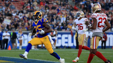 LOS ANGELES, CA - DECEMBER 31: Lance Dunbar #25 of the Los Angeles Rams runs in a touchdown past Ahkello Witherspoon #23 and Dontae Johnson #36 of the San Francisco 49ers during the second half of a game at Los Angeles Memorial Coliseum on December 31, 2017 in Los Angeles, California. (Photo by Sean M. Haffey/Getty Images)