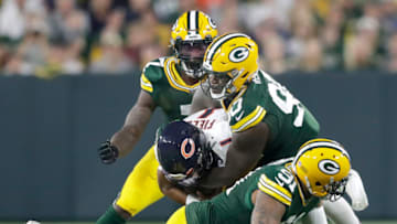 Sep 18, 2022; Green Bay, Wisconsin, USA; Green Bay Packers defensive tackle Jarran Reed (90) sacks Chicago Bears' Justin Fields (1) during their football game at Lambeau Field. Mandatory Credit: Wm. Glasheen USA TODAY NETWORK-Wisconsin