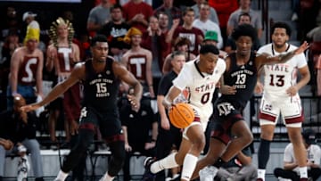 Feb 25, 2023; Starkville, Mississippi, USA; Mississippi State Bulldogs forward D.J. Jeffries (0) dribbles as Texas A&M Aggies forward Solomon Washington (13) defends during the second half at Humphrey Coliseum. Mandatory Credit: Petre Thomas-USA TODAY Sports