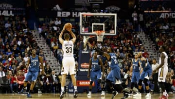 Feb 27, 2016; New Orleans, LA, USA; New Orleans Pelicans forward Ryan Anderson (33) shoots a three point basket at the buzzer over Minnesota Timberwolves forward Shabazz Muhammad (15) during the second quarter of a game at the Smoothie King Center. Mandatory Credit: Derick E. Hingle-USA TODAY Sports