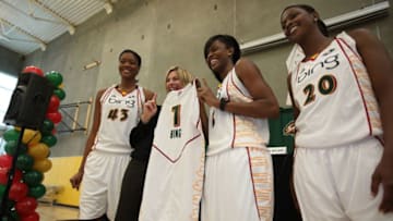 SEATTLE - APRIL 21: L to R: Ashley Robinson #43, Danielle Tiedt of Microsoft, Swin Cash #2, and Camille Little #20 pose with the Storms' new jersey at a press conference announcing a sponsorship deal with Microsoft at Ranier Vista Boys & Girls Club on April 21, 2010 in Seattle, Washington. The Storm's new jersey will feature the Bing logo as part of the deal. (Photo by Otto Greule Jr/Getty Images)