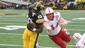 IOWA CITY, IA - NOVEMBER 23: Iowa Hawkeyes running back Mekhi Sargent (10) runs out of bounds with the ball with Nebraska Cornhuskers defensive end Mick Stoltenberg (44) defending during a Big Ten Conference football game between the Nebraska Cornhuskers and the Iowa Hawkeyes on November 23, 2018, at Kinnick Stadium, Iowa City, IA. (Photo by Keith Gillett/Icon Sportswire via Getty Images)