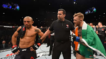 LAS VEGAS, NV - DECEMBER 12: Jose Aldo of Brazil (left) and Conor McGregor of Ireland (right) await the final decision in their UFC featherweight championship bout during the UFC 194 event inside MGM Grand Garden Arena on December 12, 2015 in Las Vegas, Nevada. (Photo by Josh Hedges/Zuffa LLC/Zuffa LLC via Getty Images)
