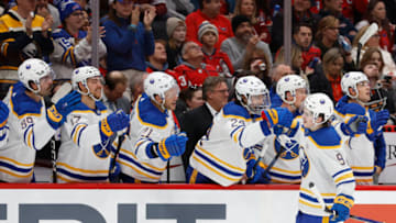 Nov 22, 2023; Washington, District of Columbia, USA; Buffalo Sabres left wing Zach Benson (9) celebrates with teammates after scoring a goal against the Washington Capitals in the first period at Capital One Arena. Mandatory Credit: Geoff Burke-USA TODAY Sports