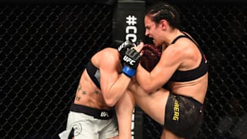 LIVERPOOL, ENGLAND - MAY 27: (R-L) Lina Lansberg of Sweden knees Gina Mazany in their women's bantamweight bout during the UFC Fight Night event at ECHO Arena on May 27, 2018 in Liverpool, England. (Photo by Josh Hedges/Zuffa LLC/Zuffa LLC via Getty Images)