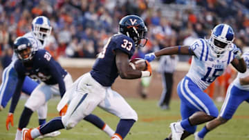 Nov 21, 2015; Charlottesville, VA, USA; Virginia Cavaliers running back Olamide Zaccheaus (33) carries the ball as Duke Blue Devils safety Quay Mann (15) defends during the first half at Scott Stadium. Mandatory Credit: Amber Searls-USA TODAY Sports