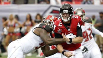 Sep 11, 2016; Atlanta, GA, USA; Atlanta Falcons quarterback Matt Ryan (2) gets hit by Tampa Bay Buccaneers defensive end Robert Ayers (91) after attempting a pass in the third quarter of their game at the Georgia Dome. The Buccaneers won 31-24. Mandatory Credit: Jason Getz-USA TODAY Sports