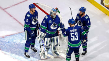 EDMONTON, ALBERTA - SEPTEMBER 03: Thatcher Demko #35 of the Vancouver Canucks is congratulated by his teammates after his 4-0 shutout victory against the Vegas Golden Knights in Game Six of the Western Conference Second Round during the 2020 NHL Stanley Cup Playoffs at Rogers Place on September 03, 2020 in Edmonton, Alberta, Canada. (Photo by Bruce Bennett/Getty Images)