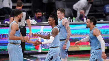 Feb 14, 2021; Sacramento, California, USA; Memphis Grizzlies guard Ja Morant (12) walks towards the team bench during a timeout against the Sacramento Kings in the second quarter at the Golden 1 Center. Mandatory Credit: Cary Edmondson-USA TODAY Sports
