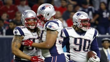 Dec 13, 2015; Houston, TX, USA; New England Patriots defensive tackle Malcom Brown (90) and defensive end Jabaal Sheard (93) celebrate recovering a fumble during the second half against the Houston Texans at NRG Stadium. Mandatory Credit: Kevin Jairaj-USA TODAY Sports