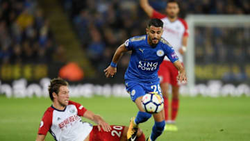 LEICESTER, ENGLAND - OCTOBER 16: Riyad Mahrez of Leicester City and Grzegorz Krychowiak of West Bromwich Albion in action during the Premier League match between Leicester City and West Bromwich Albion at The King Power Stadium on October 16, 2017 in Leicester, England. (Photo by Ross Kinnaird/Getty Images)