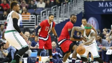 Jan 16, 2016; Washington, DC, USA; Boston Celtics guard Isaiah Thomas (4) defended by Washington Wizards guard John Wall (2) during the game at Verizon Center. Mandatory Credit: Mitch Stringer-USA TODAY Sports