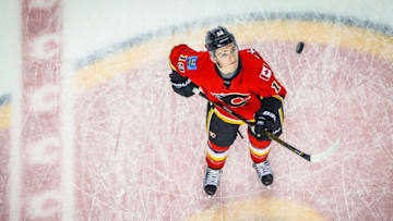 Dec 14, 2016; Calgary, Alberta, CAN; Calgary Flames left wing Matthew Tkachuk (19) controls the puck during the warmup period against the Tampa Bay Lightning at Scotiabank Saddledome. Mandatory Credit: Sergei Belski-USA TODAY Sports