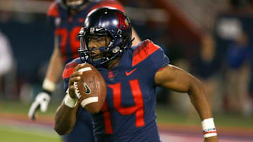 TUCSON, AZ - NOVEMBER 02: Arizona Wildcats quarterback Khalil Tate (14) scrambles with the ball during a college football game between the Colorado Buffaloes and Arizona Wildcats on November 02, 2018, at Arizona Stadium in Tucson, AZ. (Photo by Jacob Snow/Icon Sportswire via Getty Images)