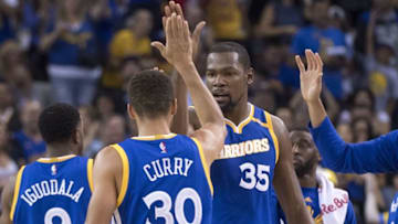 November 13, 2016; Oakland, CA, USA; Golden State Warriors forward Kevin Durant (35) celebrates with guard Stephen Curry (30) against the Phoenix Suns during the second quarter at Oracle Arena. Mandatory Credit: Kyle Terada-USA TODAY Sports