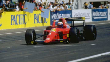 1990: Alain Prost of France punches the air in celebration after passing the chequered flag in his Scuderia Ferrari to win the French Grand Prix at the Paul Ricard circuit in Le Beausset, France. Mandatory Credit: Pascal Rondeau/Allsport
