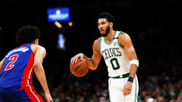 Jayson Tatum #0 of the Boston Celtics brings the ball up court against Cade Cunningham #2 of the Detroit Pistons (Photo by Omar Rawlings/Getty Images)
