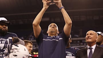 Dec 3, 2016; Indianapolis, IN, USA; Penn State Nittany Lions head coach James Franklin gets the trophy from Big Ten commissioner Jim Delany after defeating the Wisconsin Badgers during the Big Ten Championship college football game at Lucas Oil Stadium. Mandatory Credit: Brian Spurlock-USA TODAY Sports