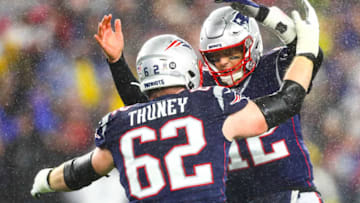 FOXBOROUGH, MA - NOVEMBER 24: Tom Brady #12 of the New England Patriots celebrates with Joe Thuney #62 of the New England Patriots after a touchdown in the first quarter of a game against the Dallas Cowboys at Gillette Stadium on November 24, 2019 in Foxborough, Massachusetts. (Photo by Adam Glanzman/Getty Images)