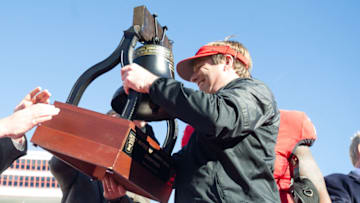 MEMPHIS, TN - DECEMBER 30: Head coach Kirby Smart of the Georgia Bulldogs lifts up the Liberty Bowl Trophy after they defeated the TCU Horned Frogs at Liberty Bowl Memorial Stadium on December 30, 2016 in Memphis, Tennessee. The Georgia Bulldogs defeated the TCU Horned Frogs 31-23. (Photo by Michael Chang/Getty Images)
