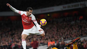 LONDON, ENGLAND - NOVEMBER 11: Henrik Mkhitaryan of Arsenal is tackled by Ryan Bennett of Wolverhampton Wanderers during the Premier League match between Arsenal FC and Wolverhampton Wanderers at Emirates Stadium on November 11, 2018 in London, United Kingdom. (Photo by Shaun Botterill/Getty Images)
