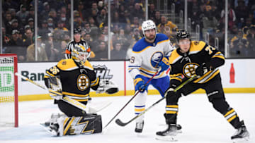 Apr 28, 2022; Boston, Massachusetts, USA; Buffalo Sabres right wing Alex Tuch (89) and Boston Bruins defenseman Charlie McAvoy (73) follow the puck during the first period at TD Garden. Mandatory Credit: Bob DeChiara-USA TODAY Sports