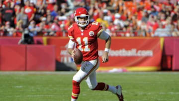 Oct 26, 2014; Kansas City, MO, USA; Kansas City Chiefs quarterback Alex Smith (11) runs for yardage against the St. Louis Rams in the second half at Arrowhead Stadium. Kansas City won the game 34-7. Mandatory Credit: John Rieger-USA TODAY Sports