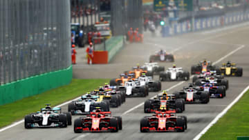 MONZA, ITALY - SEPTEMBER 02: Kimi Raikkonen of Finland driving the (7) Scuderia Ferrari SF71H and Sebastian Vettel of Germany driving the (5) Scuderia Ferrari SF71H race to the first corner ahead of Lewis Hamilton of Great Britain driving the (44) Mercedes AMG Petronas F1 Team Mercedes WO9 and Max Verstappen of the Netherlands driving the (33) Aston Martin Red Bull Racing RB14 TAG Heuer during the Formula One Grand Prix of Italy at Autodromo di Monza on September 2, 2018 in Monza, Italy. (Photo by Dan Istitene/Getty Images)