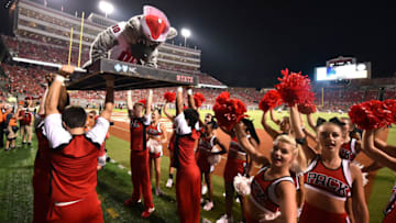 RALEIGH, NC - SEPTEMBER 05: The mascot of the North Carolina State Wolfpack does push-ups following an NC State touchdown against the Troy Trojans at Carter-Finley Stadium on September 5, 2015 in Raleigh, North Carolina. NC State defeated Troy 49-21. (Photo by Lance King/Getty Images)
