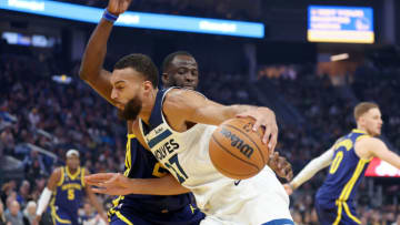 SAN FRANCISCO, CALIFORNIA - MARCH 26: Rudy Gobert #27 of the Minnesota Timberwolves is guarded by Draymond Green #23 of the Golden State Warriors in the first half at Chase Center on March 26, 2023 in San Francisco, California. NOTE TO USER: User expressly acknowledges and agrees that, by downloading and or using this photograph, User is consenting to the terms and conditions of the Getty Images License Agreement. (Photo by Ezra Shaw/Getty Images)