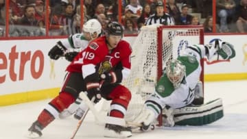 Nov 3, 2013; Ottawa, Ontario, CAN; Dallas Stars goalie Kari Lehtonen (32) blocks Ottawa Senators centre Jason Spezza (19) in the second period at the Canadian Tire Centre. Mandatory Credit: Marc DesRosiers-USA TODAY Sports