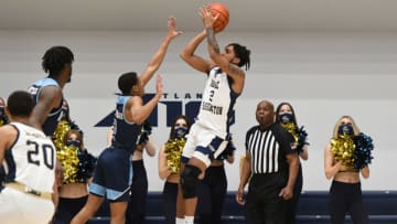 WASHINGTON, DC - FEBRUARY 19: Brayon Freeman #2 of the George Washington Colonials takes a shot over Jeremy Sheppard #2 of the Rhode Island Rams during a college basketball game at the Smith Center on February 19, 2022 in Washington, DC. (Photo by Mitchell Layton/Getty Images)