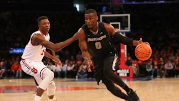 Mar 5, 2016; Queens, NY, USA; Providence Friars forward Ben Bentil (0) dribbles the ball around St. John's Red Storm forward Kassoum Yakwe (14) during the first half at Madison Square Garden. Mandatory Credit: Anthony Gruppuso-USA TODAY Sports