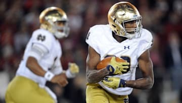 November 28, 2015; Stanford, CA, USA; Notre Dame Fighting Irish running back Josh Adams (33) runs the ball against Stanford Cardinal during the second half at Stanford Stadium. Mandatory Credit: Gary A. Vasquez-USA TODAY Sports