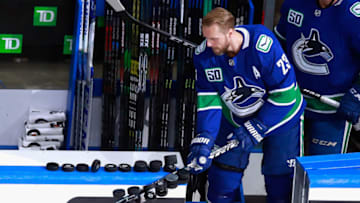 EDMONTON, ALBERTA - AUGUST 17: Alexander Edler #23 of the Vancouver Canucks gets ready for warm-ups prior to his game against the St. Louis Blues in Game Four of the Western Conference First Round during the 2020 NHL Stanley Cup Playoffs at Rogers Place on August 17, 2020 in Edmonton, Alberta, Canada. (Photo by Jeff Vinnick/Getty Images)