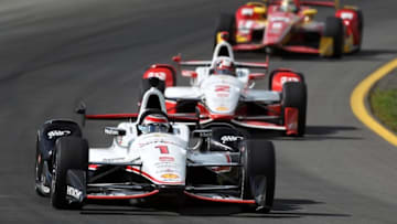 Aug 23, 2015; Long Pond, PA, USA; Verizon IndyCar Series driver Will Power (1) leads driver Juan Pablo Montoya (2) during the ABC Supply 500 at Pocono Raceway. Mandatory Credit: Matthew O