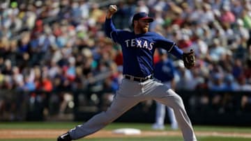 SURPRISE, AZ - FEBRUARY 27: Tommy Hanson #19 of the Texas Rangers pitches during the spring training game against the Kansas City Royals at Surprise Stadium on February 27, 2014 in Surprise, Arizona. (Photo by Mike McGinnis/Getty Images)