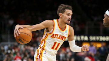 Dec 17, 2021; Atlanta, Georgia, USA; Atlanta Hawks guard Trae Young (11) dribbles against the Denver Nuggets in the second half at State Farm Arena. Mandatory Credit: Brett Davis-USA TODAY Sports