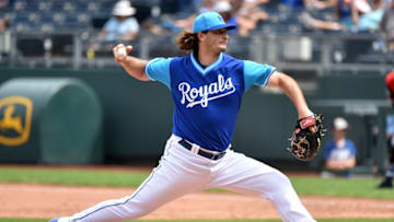 KANSAS CITY, MO - AUGUST 26: Burch Smith #64 relief pitcher of the Kansas City Royals throws in the fifth inning against the Cleveland Indians at Kauffman Stadium on August 26, 2018 in Kansas City, Missouri. All players across MLB will wear nicknames on their backs as well as colorful, non traditional uniforms featuring alternate designs inspired by youth-league uniforms during Players Weekend. (Photo by Ed Zurga/Getty Images)